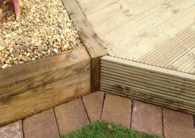 Landscapers sleeper raised bed and tegula mowing edge